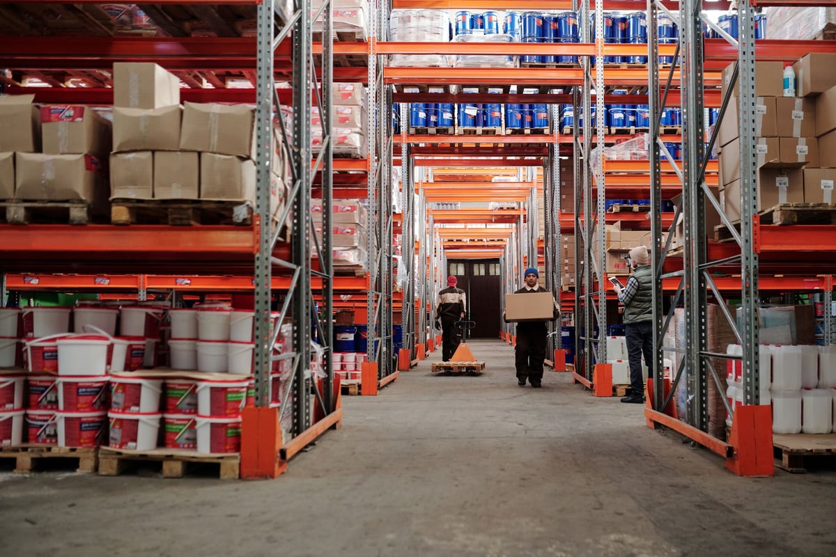 Business counterparts reviewing wholesale conditions